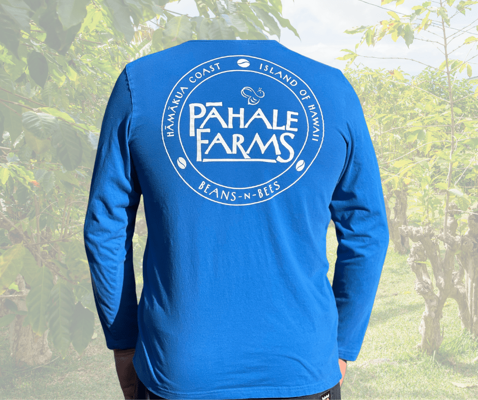 A person wearing a long sleeve shirt with the words pahale farms on it.